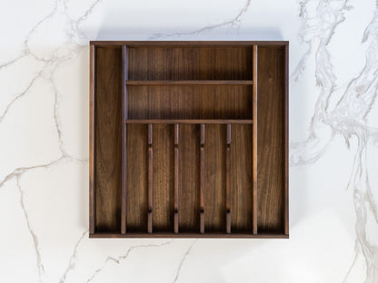 Walnut kitchen drawer organizer, handmade in Arizona, tailored to you, shown on marble countertop.