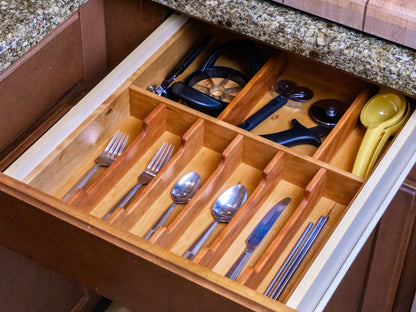 Walnut kitchen drawer organizer with utensils and gadgets, handmade in Arizona, tailored for effective storage and organization.