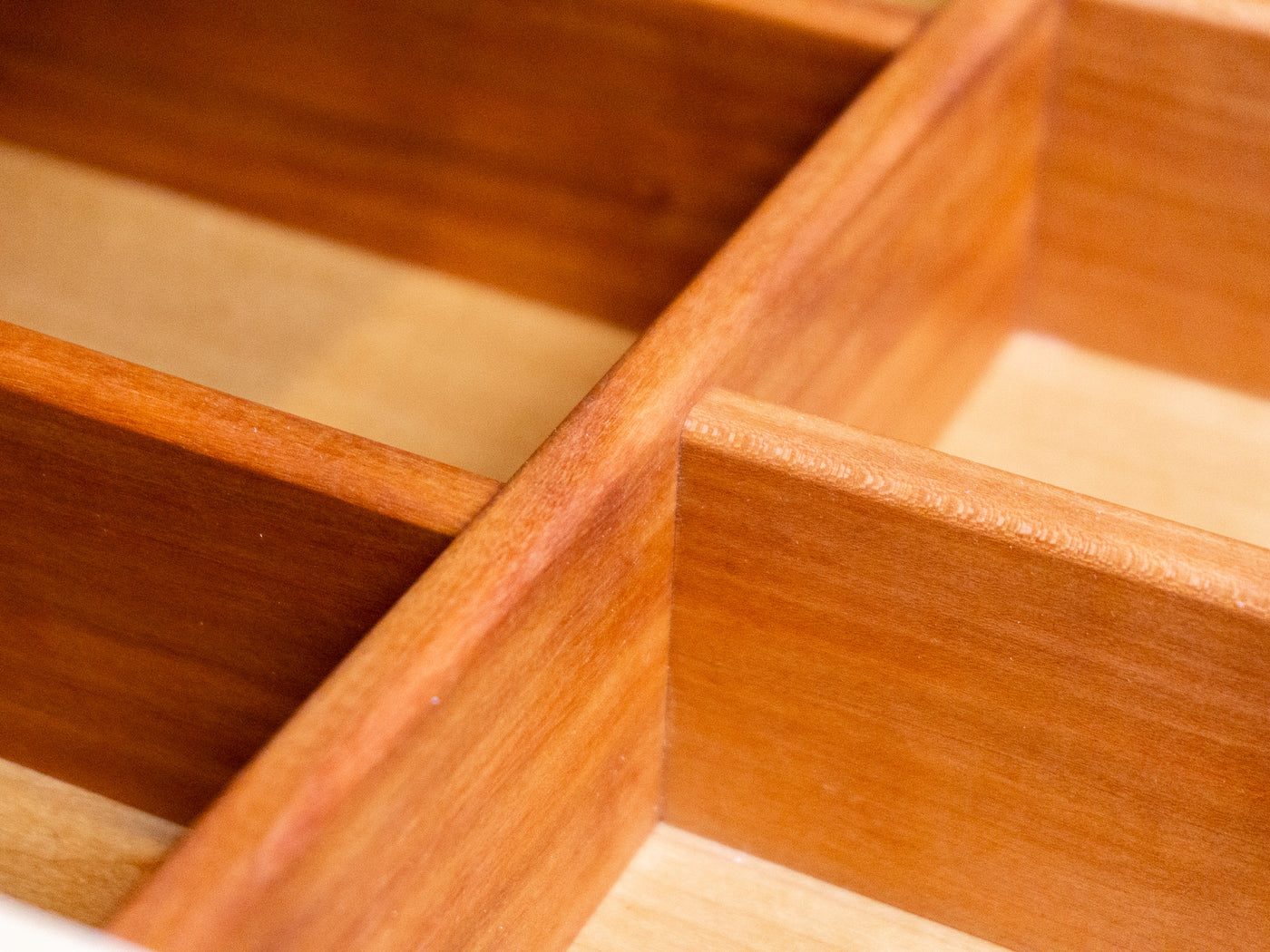A single piece of 3/8" hardwood. Cut and fitted for one drawer.